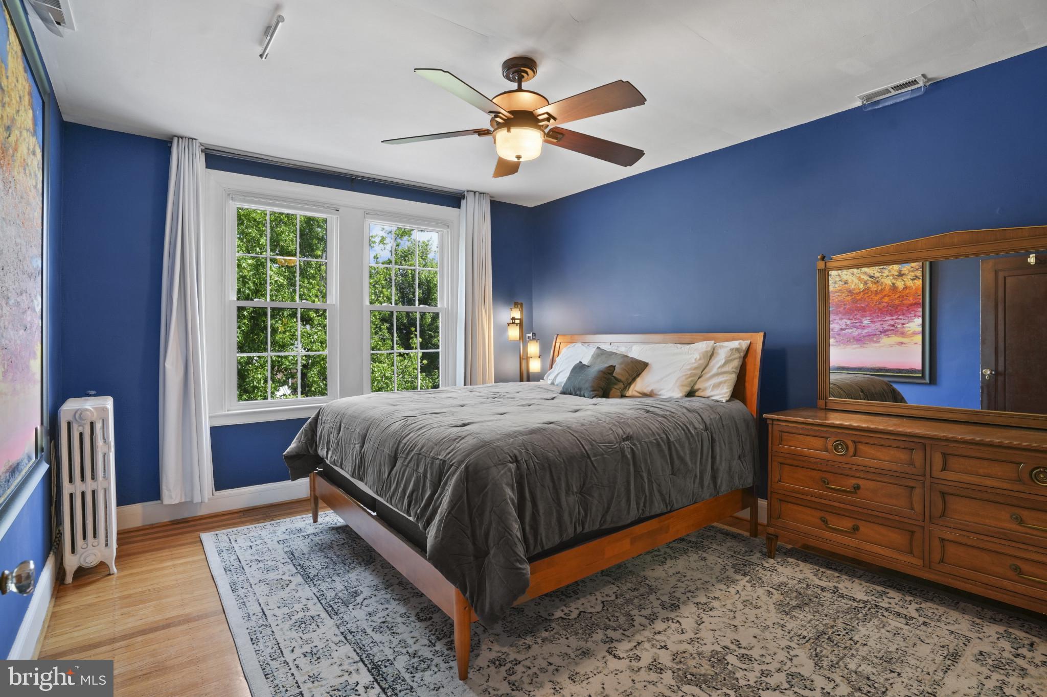 3618 Ednor Road Baltimore, MD 21218 - Photo 15 of 30 a bed sitting in a bedroom next to a window