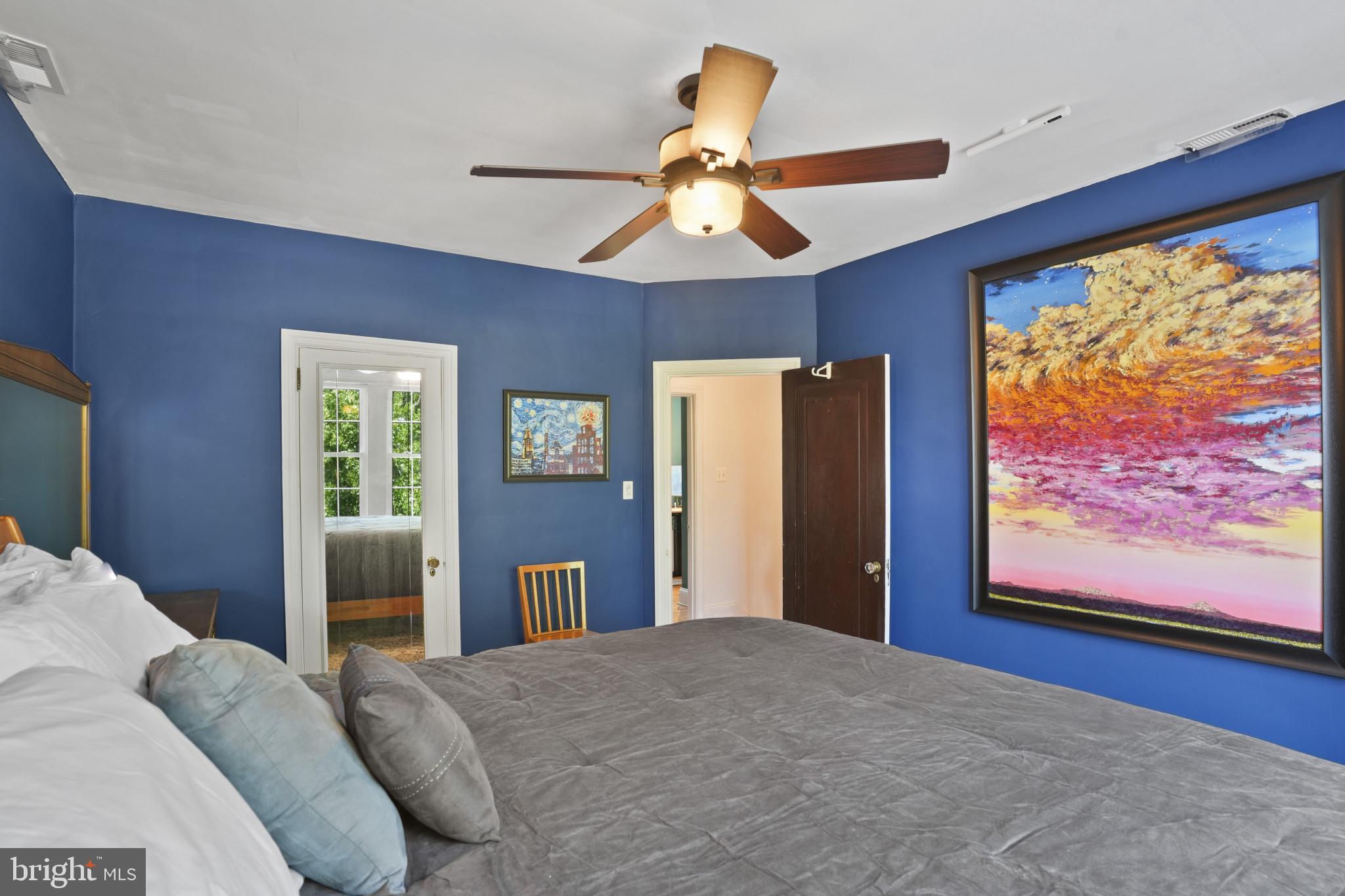 3618 Ednor Road Baltimore, MD 21218 - Photo 18 of 30 a bedroom with a bed and a flat screen tv