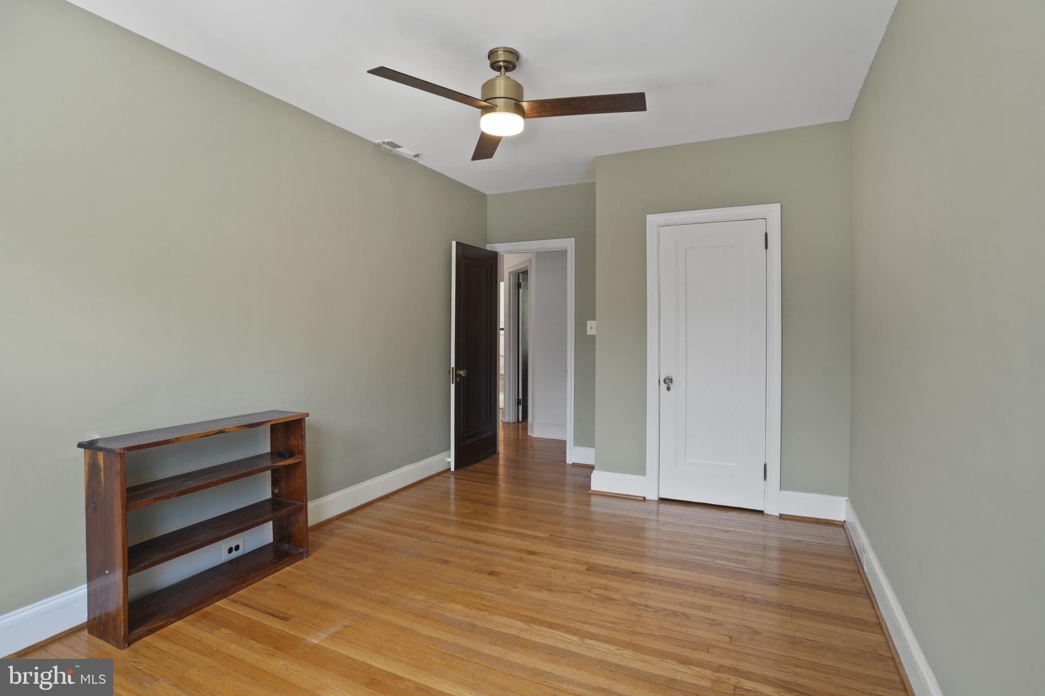 3618 Ednor Road Baltimore, MD 21218 - Photo 23 of 30 a view of room with wooden floor and ceiling fan
