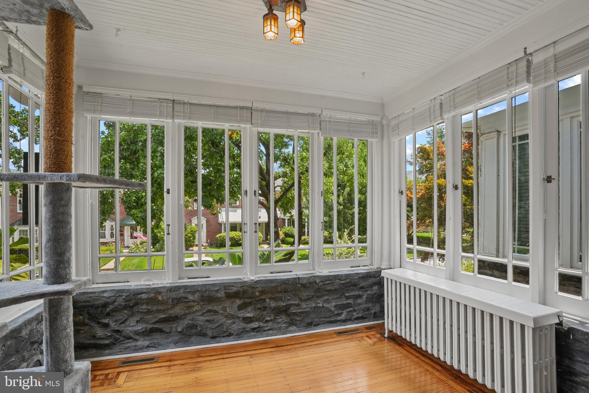 3618 Ednor Road Baltimore, MD 21218 - Photo 5 of 30 a view of a porch with a floor to ceiling window