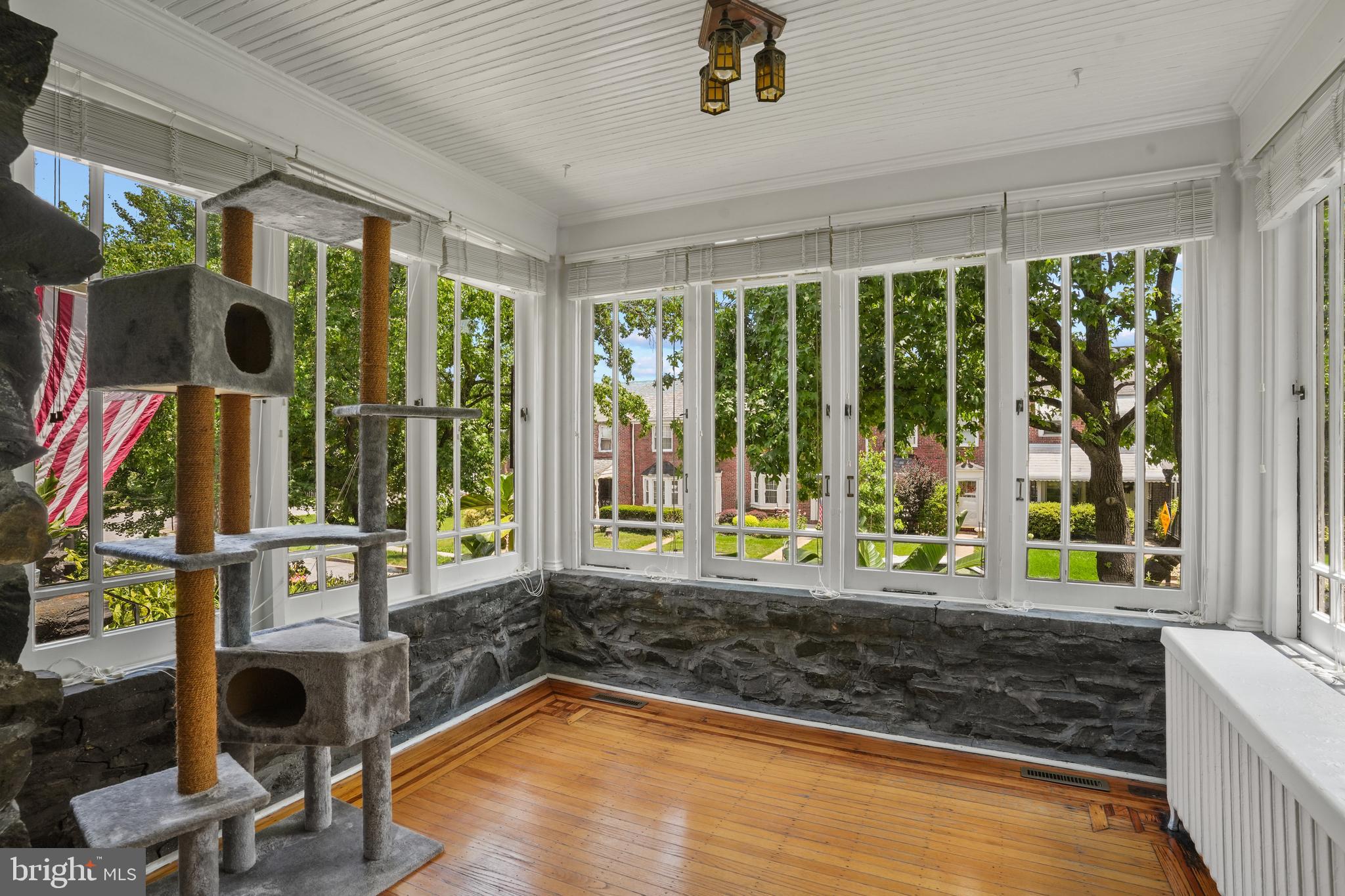 3618 Ednor Road Baltimore, MD 21218 - Photo 6 of 30 a living room filled with furniture and a floor to ceiling window