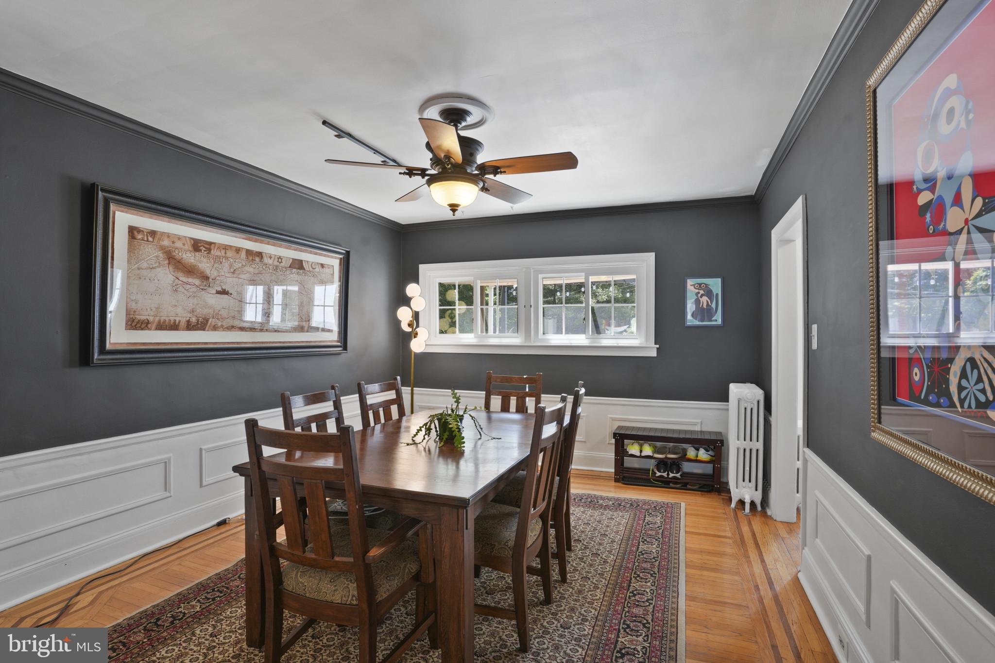 3618 Ednor Road Baltimore, MD 21218 - Photo 9 of 30 a dining room with furniture a rug and wooden floor