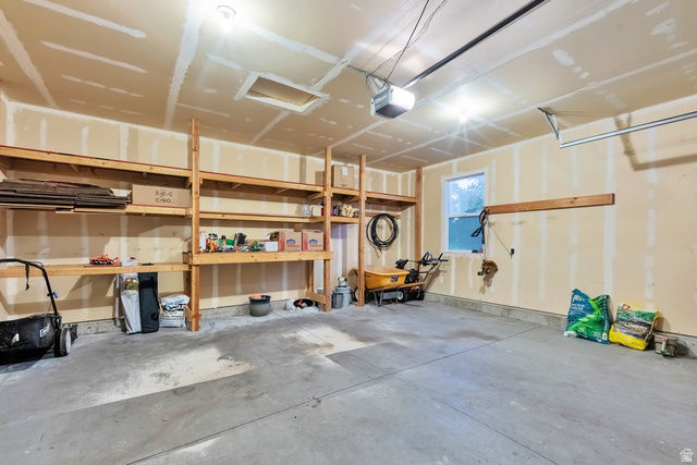 Undisclosed Address Ogden, UT 84403 - Photo 10 of 21 Garage featuring a garage door opener