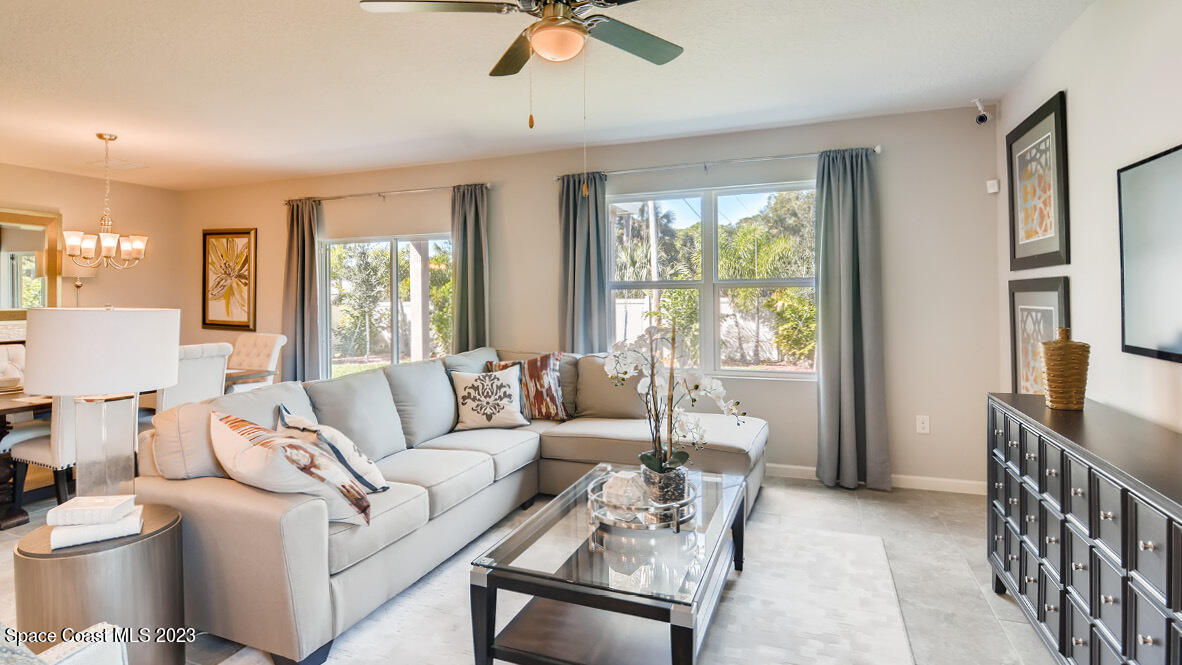 409 Old Road Palm Bay, FL 32908 - Photo 4 of 15 a living room with furniture and a large window