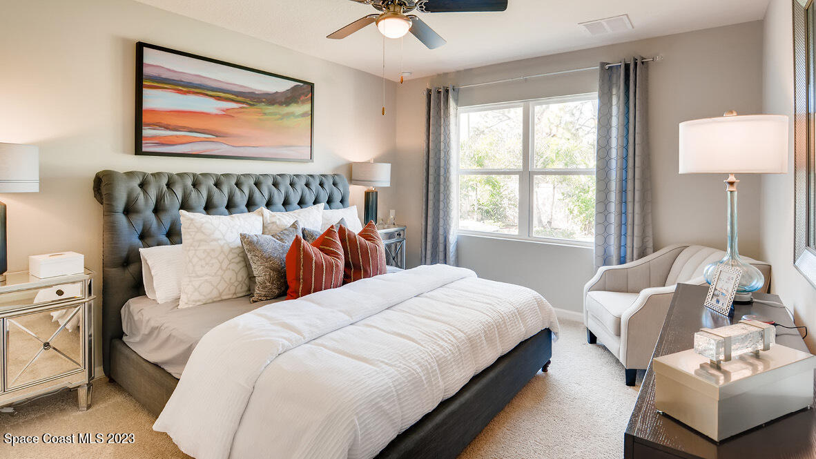 409 Old Road Palm Bay, FL 32908 - Photo 5 of 15 a bedroom with bed and a window