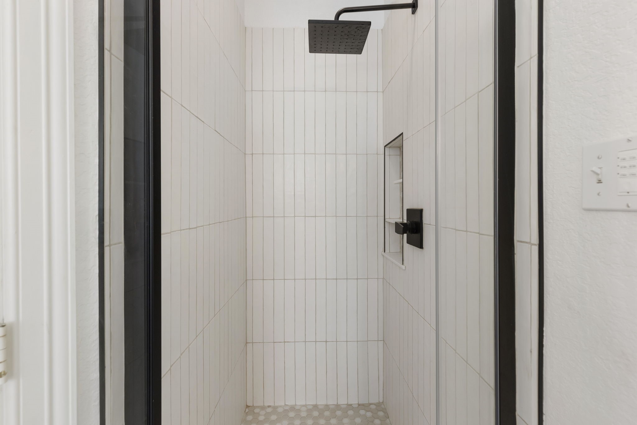 71 Sagamore Ridge Place The Woodlands, TX 77389 - Photo 25 of 34 a bathroom with a shower