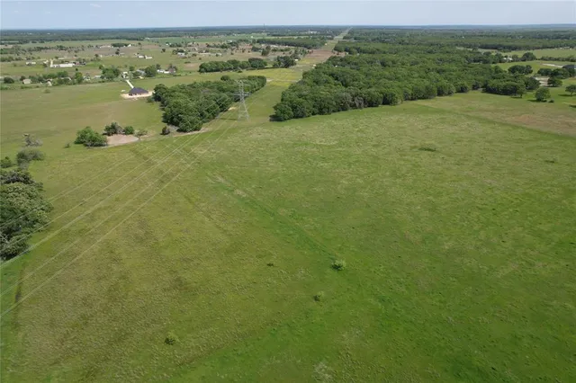 a view of a field with an ocean