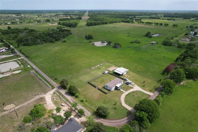 a view of a lake with a yard
