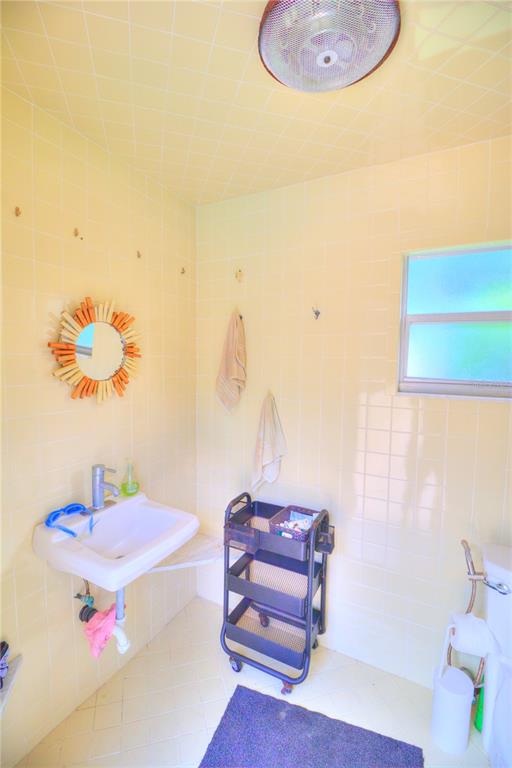 2313 Southeast 7th Street Ocala, FL 34471 - Photo 13 of 42 a bath room with a table