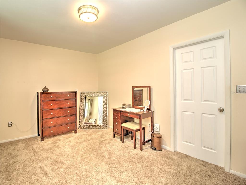 2313 Southeast 7th Street Ocala, FL 34471 - Photo 23 of 42 a view of a bedroom with closet and cabinet