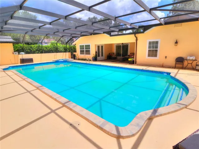 a view of a backyard with seating area