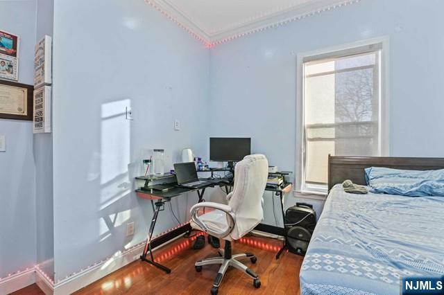 7 Martin Street Paterson, NJ 07501 - Photo 13 of 18 a living room with furniture a rug and a window