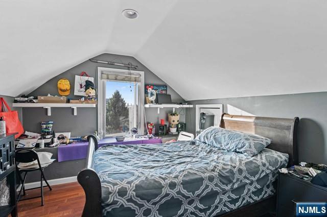 7 Martin Street Paterson, NJ 07501 - Photo 14 of 18 a bedroom with a bed a desk and chair