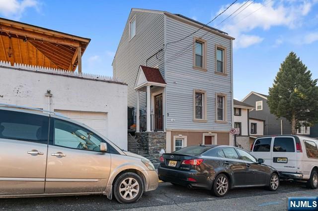 7 Martin Street Paterson, NJ 07501 - Photo 15 of 18 a view of a car parked in front of a house