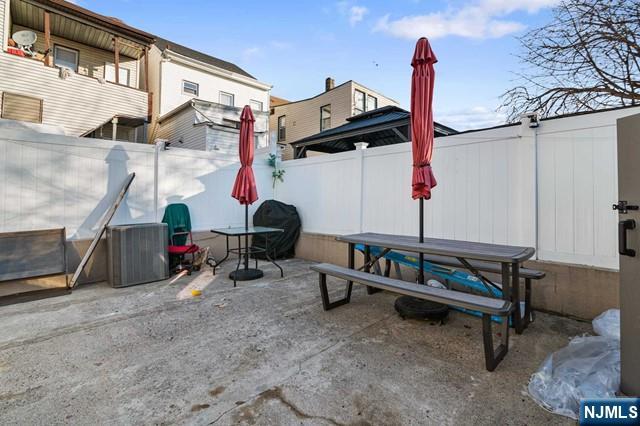 7 Martin Street Paterson, NJ 07501 - Photo 17 of 18 a view of backyard with a tv and a couch