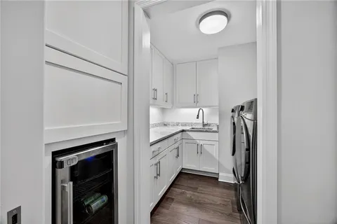 a kitchen with a refrigerator sink and stove