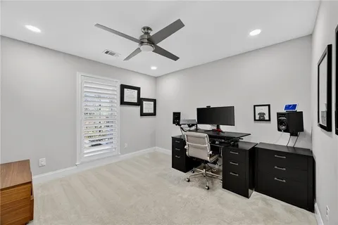 a view of a workspace with furniture