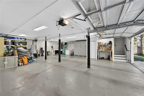 a view of a hallway with a bike and garage