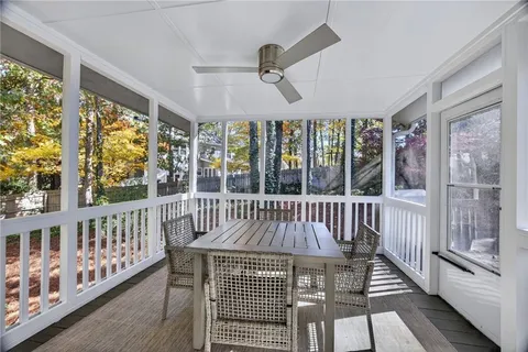 a view of a two chairs in the balcony