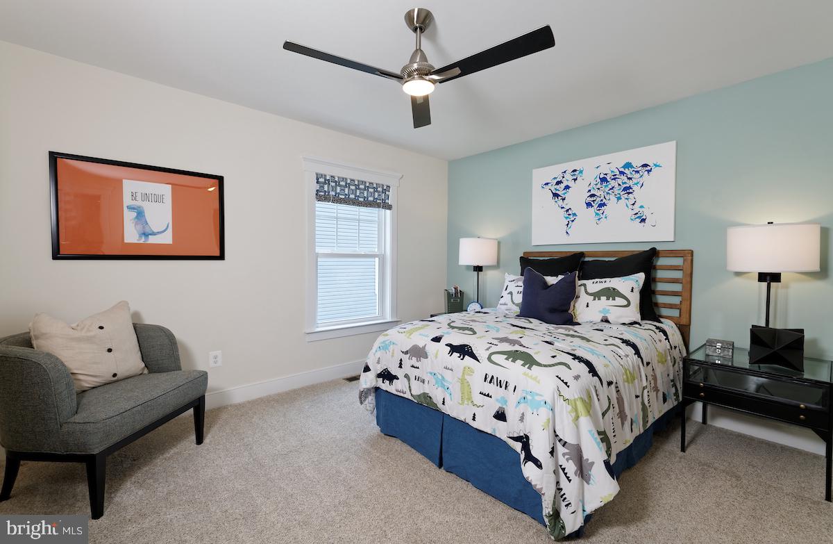 111 Interlace Way Stephenson, VA 22656 - Photo 13 of 27 a bedroom with a bed and a couch