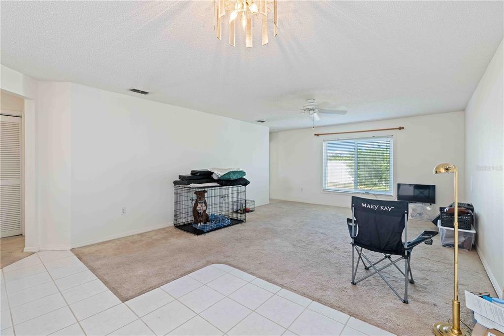4513 Dover St Circle East Bradenton, FL 34203 - Photo 12 of 30 a living room with furniture and a window