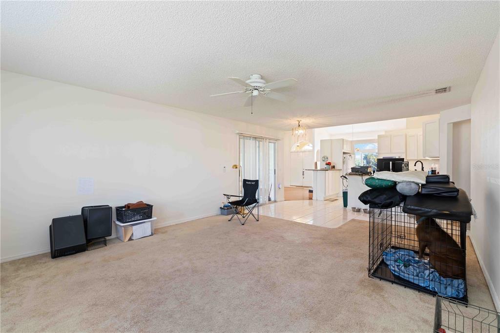 4513 Dover St Circle East Bradenton, FL 34203 - Photo 13 of 30 a room with gym equipment and a view of living room