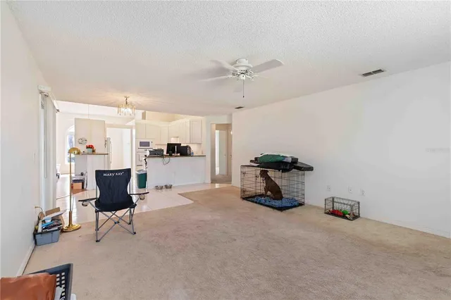 a view of a livingroom with furniture and a window
