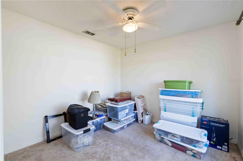 4513 Dover St Circle East Bradenton, FL 34203 - Photo 15 of 30 a living room with furniture and a chandelier