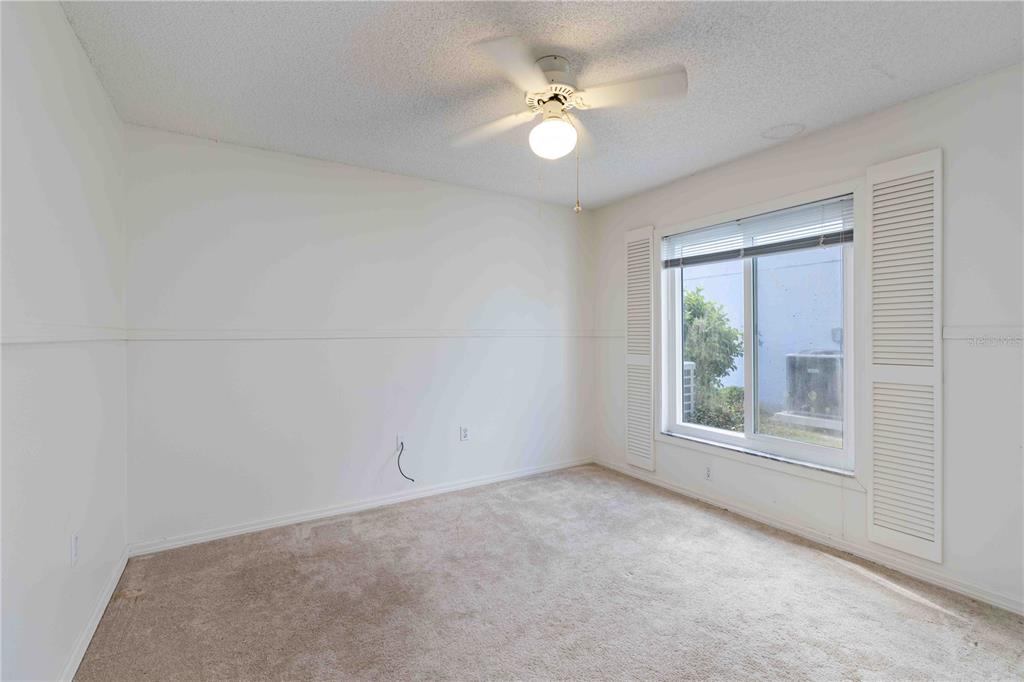 4513 Dover St Circle East Bradenton, FL 34203 - Photo 17 of 30 an empty room with a window