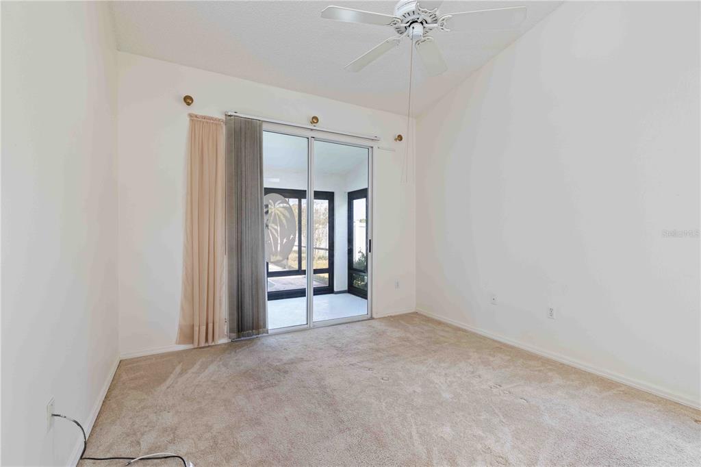 4513 Dover St Circle East Bradenton, FL 34203 - Photo 21 of 30 a view of a room with a ceiling fan and window