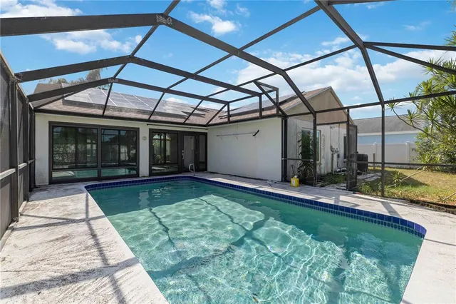 a view of swimming pool with a patio