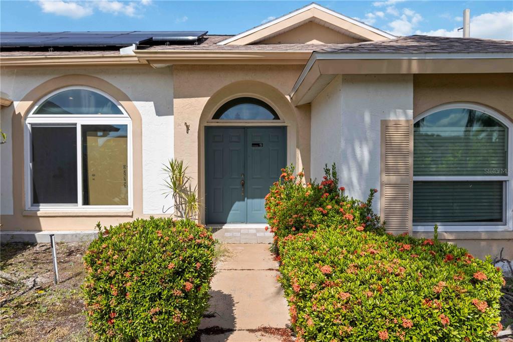 4513 Dover St Circle East Bradenton, FL 34203 - Photo 4 of 30 a front view of a house with garden