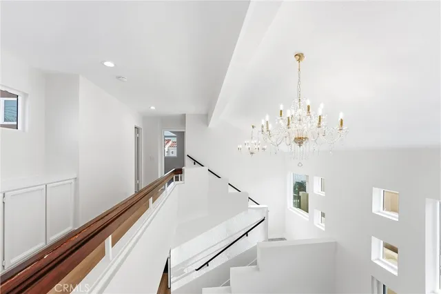 a view of a hallway with windows