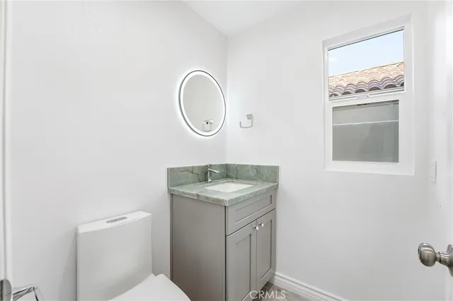 a utility room with a sink dryer and washer