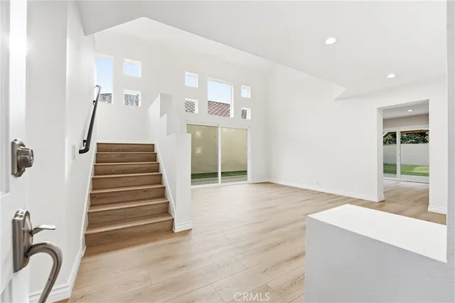 a view of an entryway with wooden floor and a window