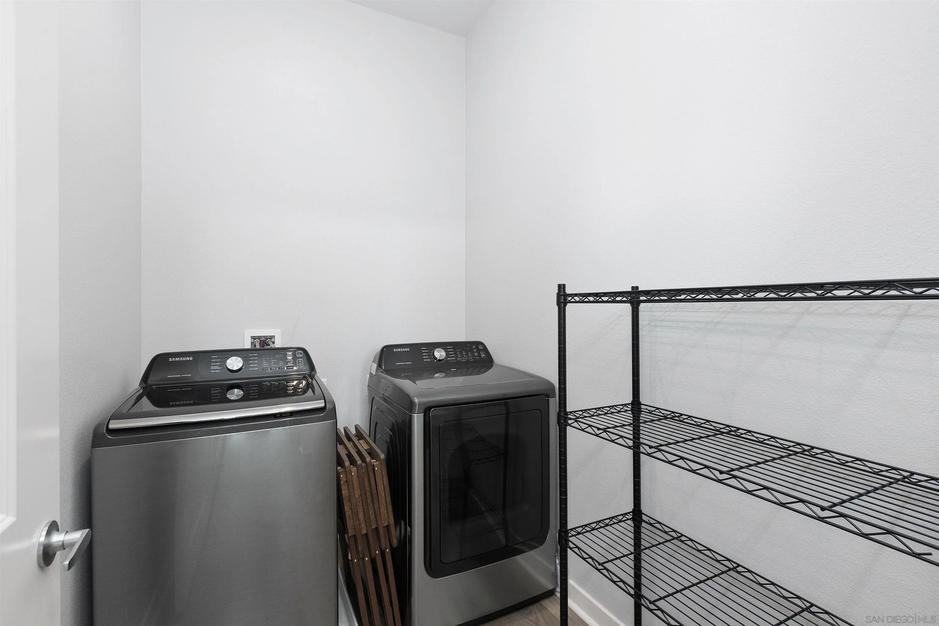 3002 Bravo Loop, Unit 4 Chula Vista, CA 91915 - Photo 11 of 36 a view of storage and utility room with washer and dryer