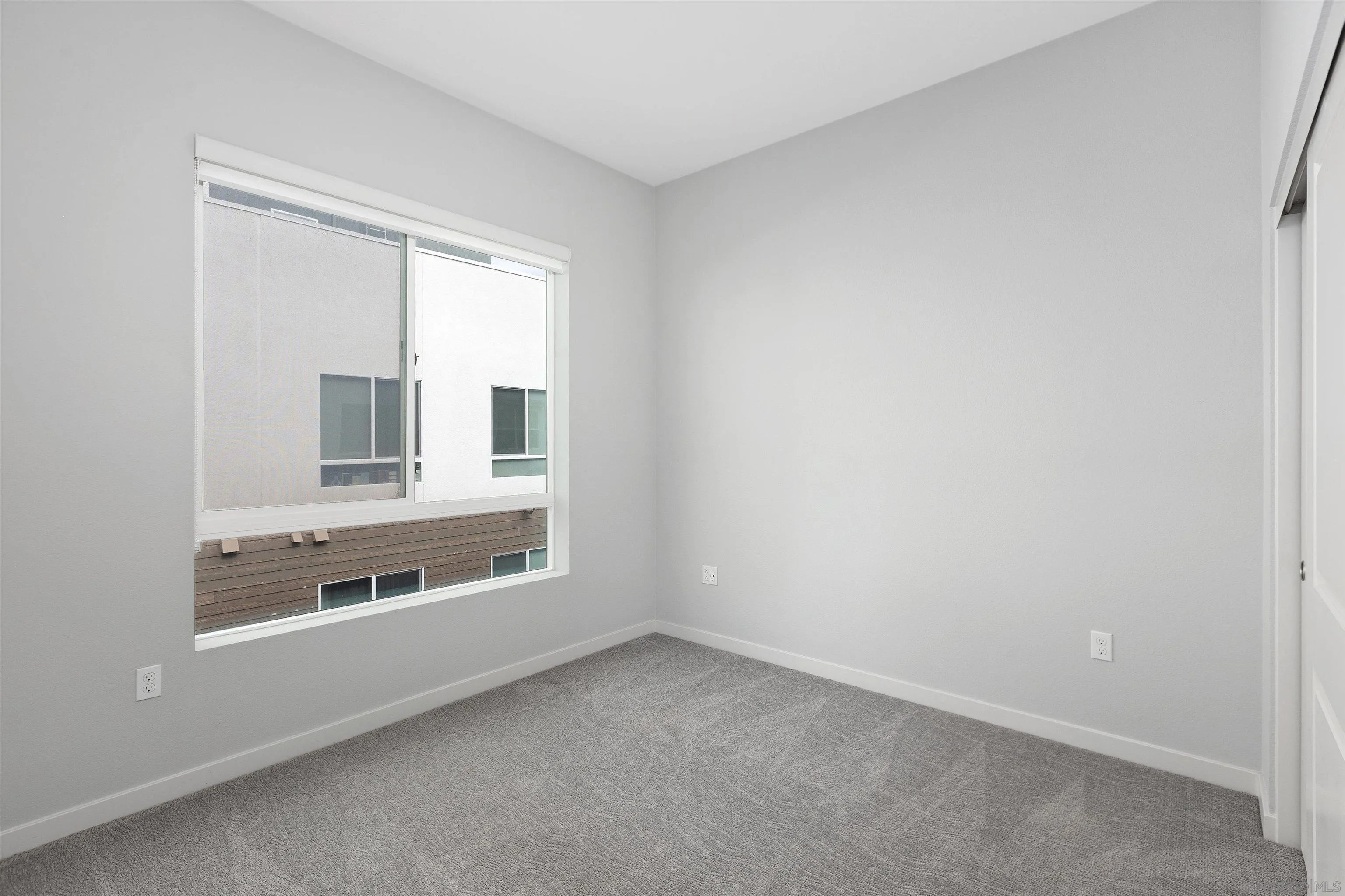 3002 Bravo Loop, Unit 4 Chula Vista, CA 91915 - Photo 19 of 36 a view of an empty room with a window