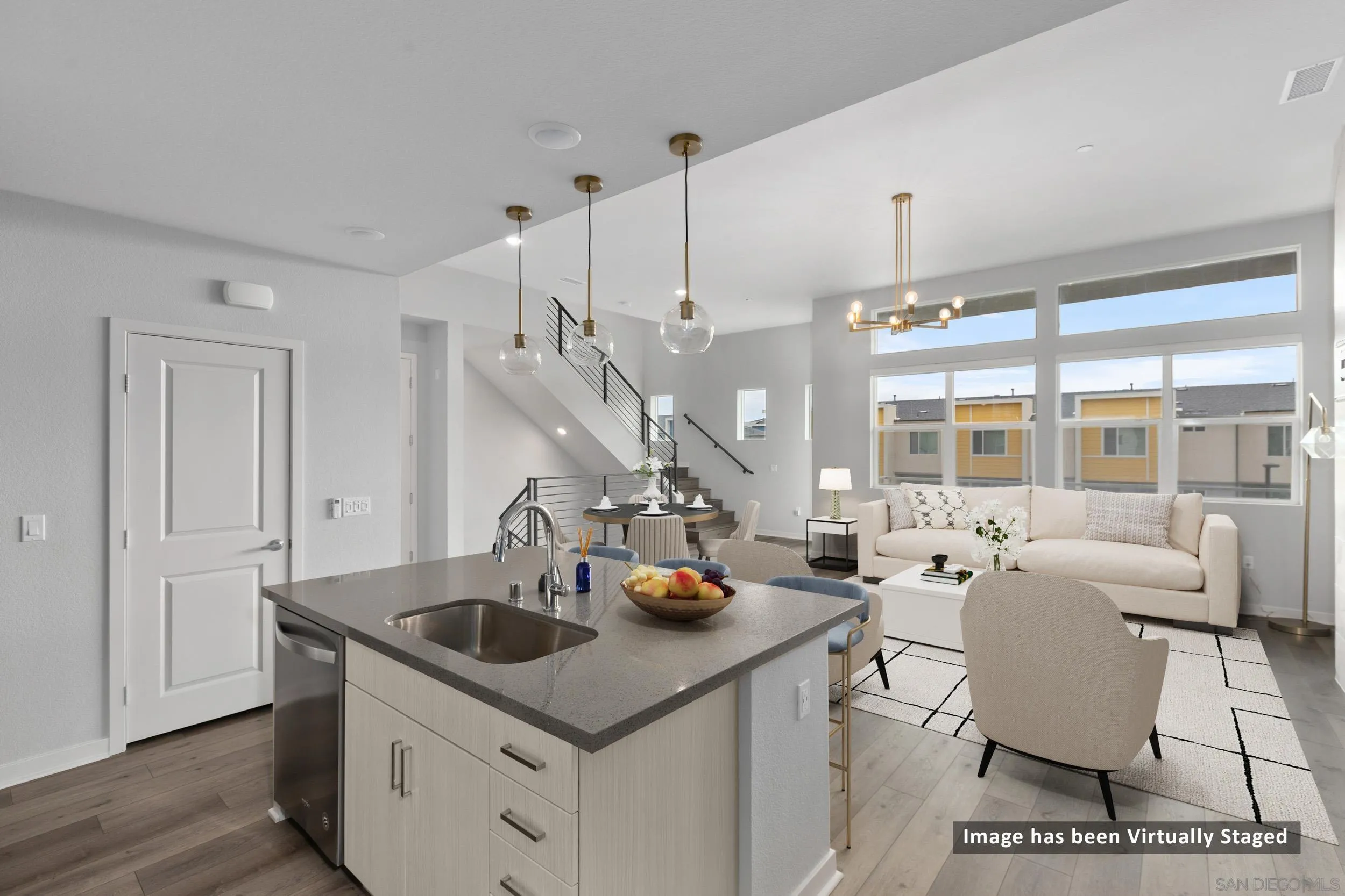 3002 Bravo Loop, Unit 4 Chula Vista, CA 91915 - Photo 2 of 36 a kitchen with stainless steel appliances granite countertop a sink a stove and a wooden floors