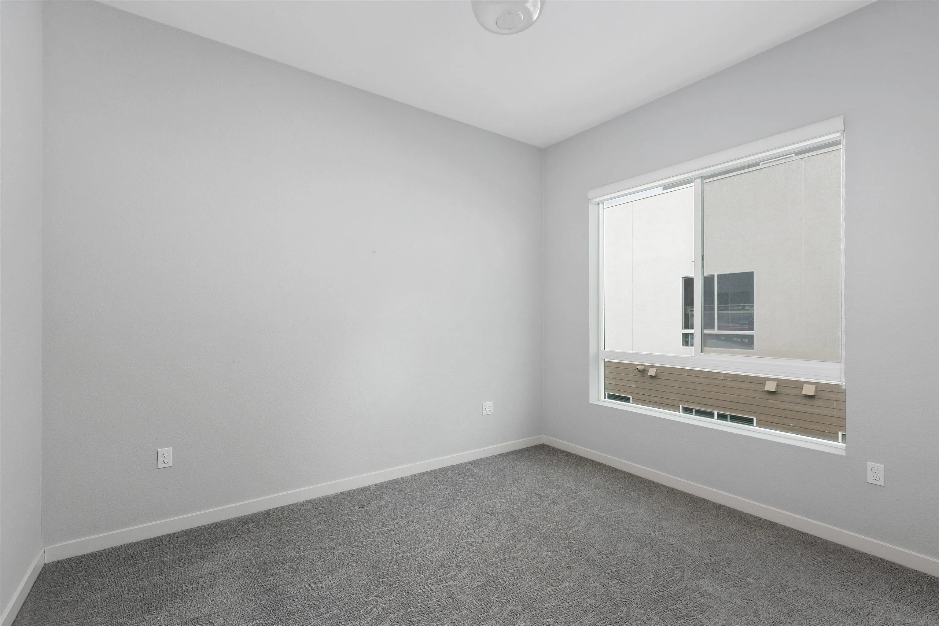3002 Bravo Loop, Unit 4 Chula Vista, CA 91915 - Photo 22 of 36 a view of an empty room with a window