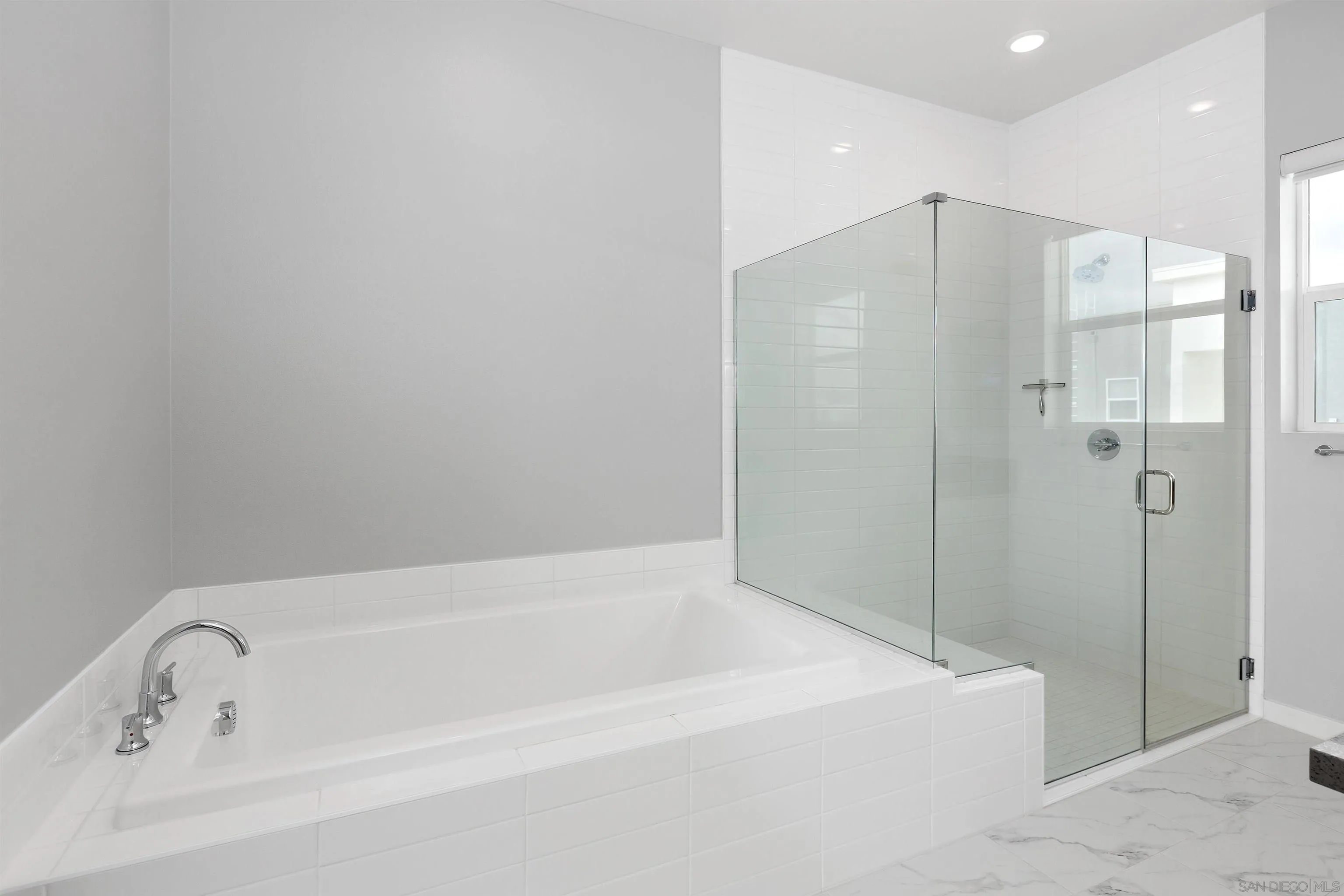 3002 Bravo Loop, Unit 4 Chula Vista, CA 91915 - Photo 28 of 36 a white bath tub sitting next to a shower