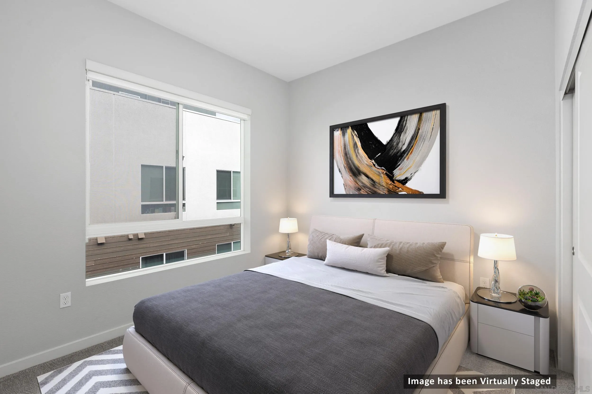 3002 Bravo Loop, Unit 4 Chula Vista, CA 91915 - Photo 3 of 36 a bedroom with a bed and a painting on the wall