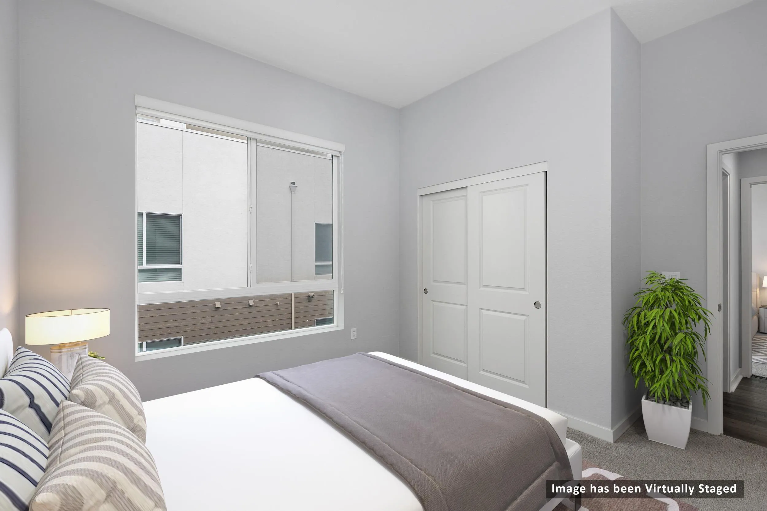 3002 Bravo Loop, Unit 4 Chula Vista, CA 91915 - Photo 4 of 36 a bedroom with a bed and a couch