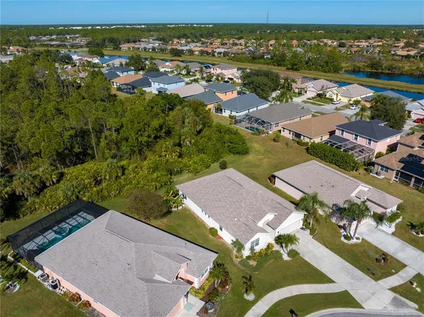 an aerial view of residential houses with outdoor space