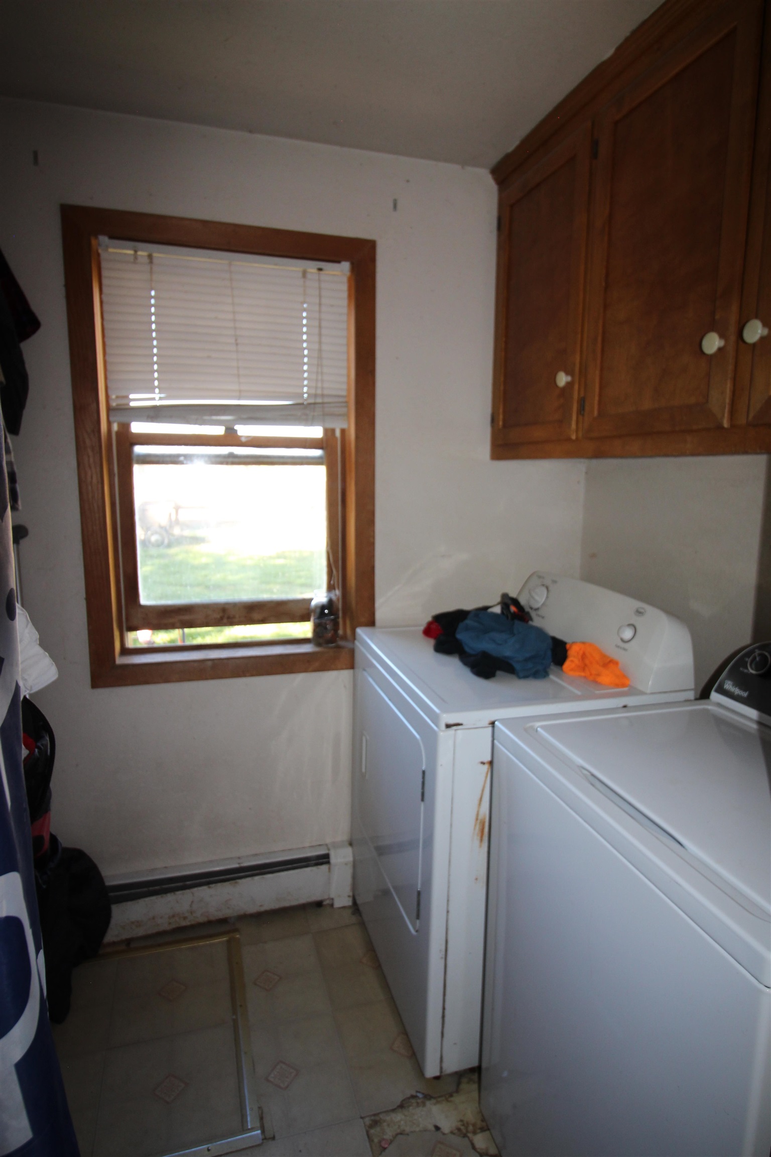 1873 K Road Fruita, CO 81521 - Photo 13 of 26 a storage room with wooden floor and cabinets
