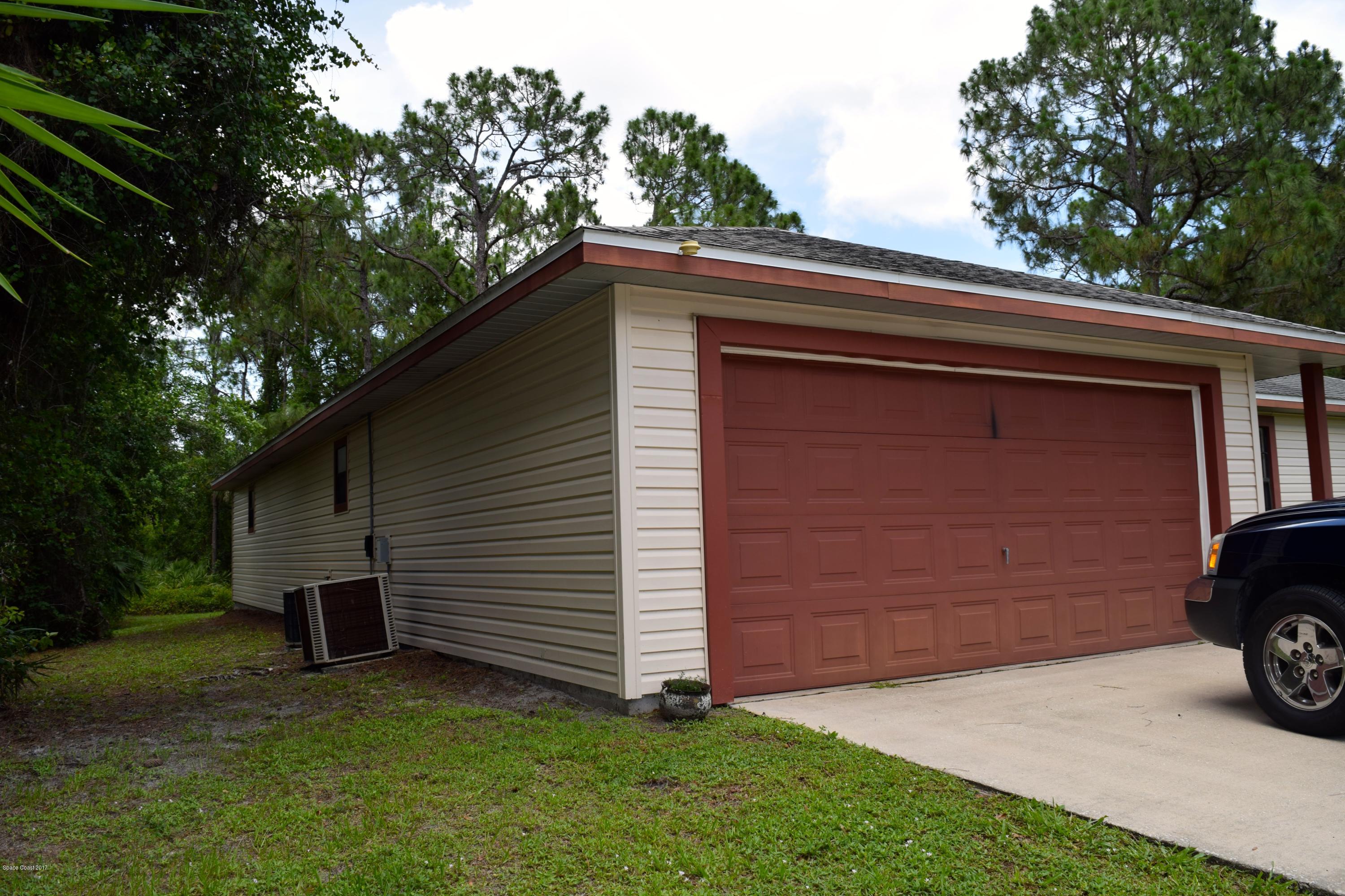1283 Wing Road Southwest Palm Bay, FL 32908 - Photo 3 of 58 2 CAR GARAGE