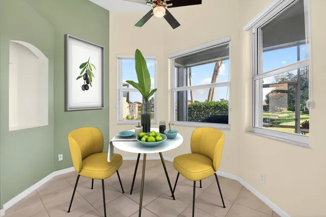 a bedroom with a bed lamp and a window