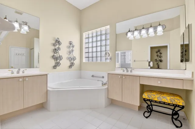 a bedroom with a bed and a mirror