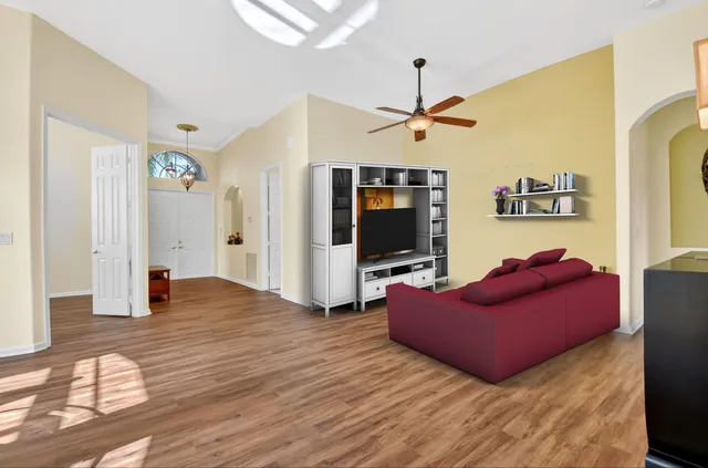 a view of a livingroom with furniture and a window