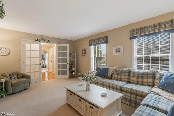 a living room with furniture and windows