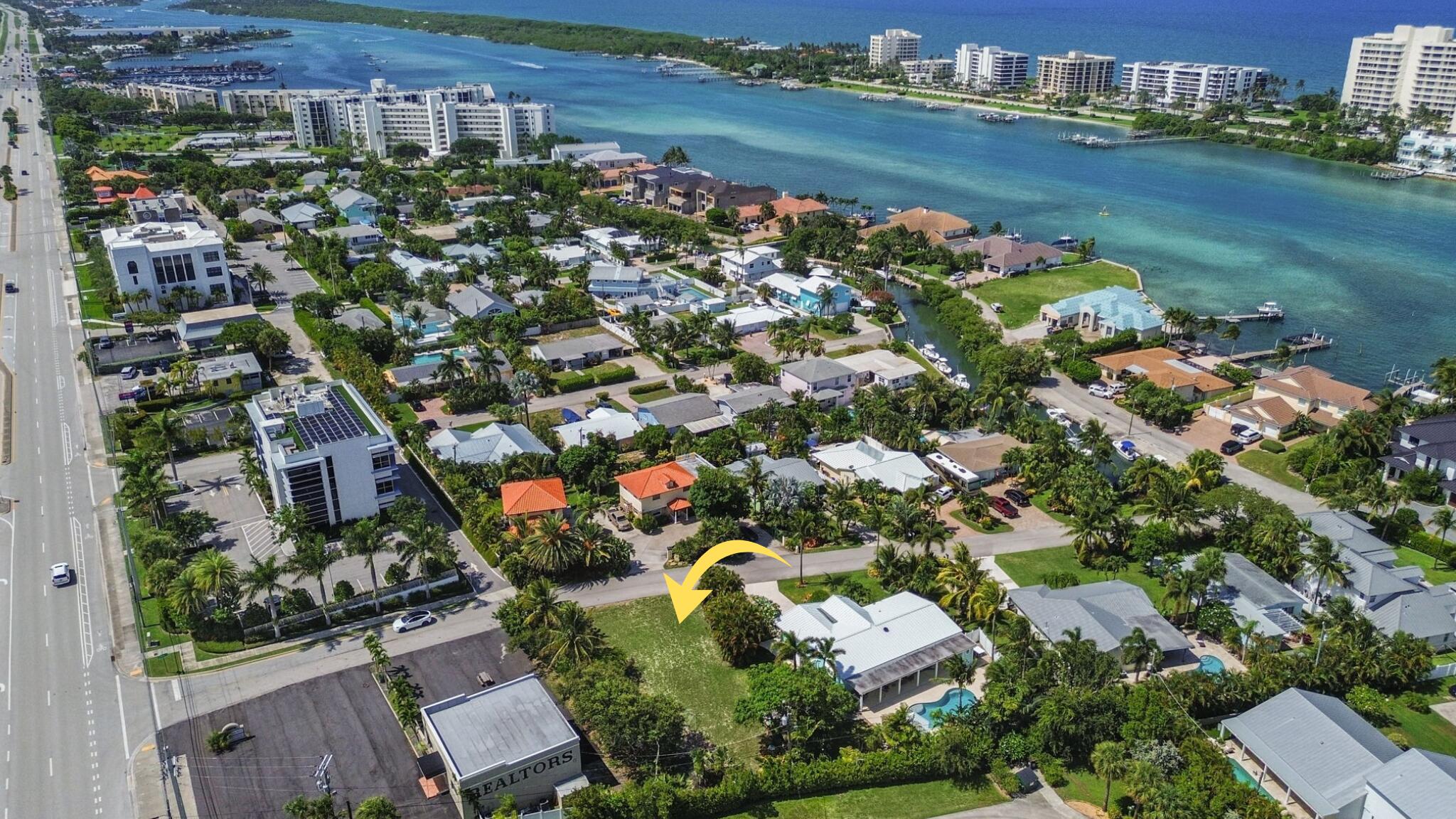 3442 Harbor Road South Jupiter, FL 33469 - Photo 1 of 8 an aerial view of a houses with outdoor space